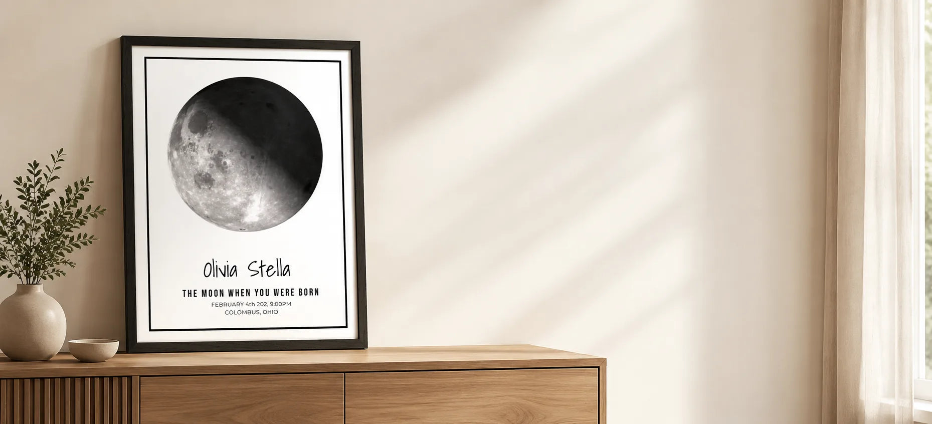 Framed personalised moon phase print on a wall