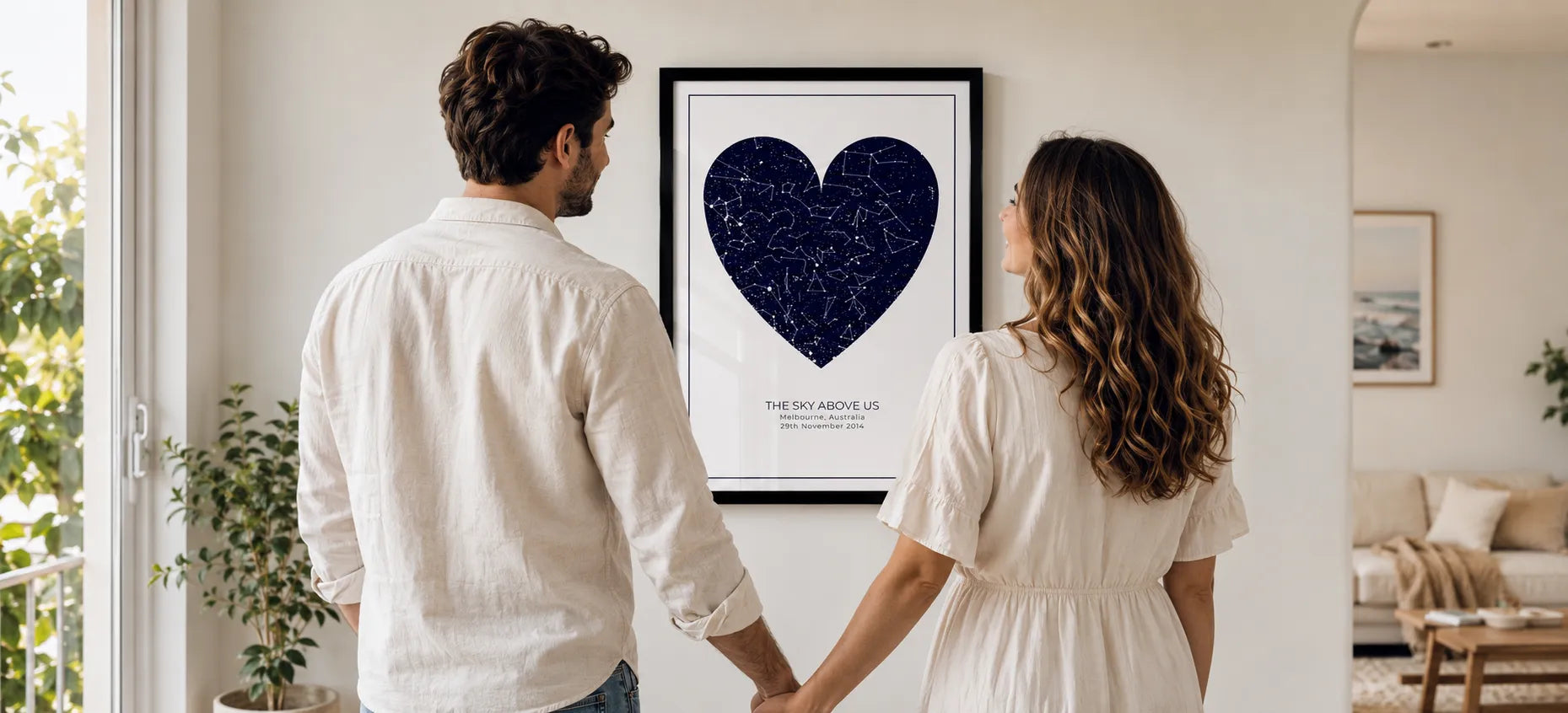 Framed personalised star map print on a wall