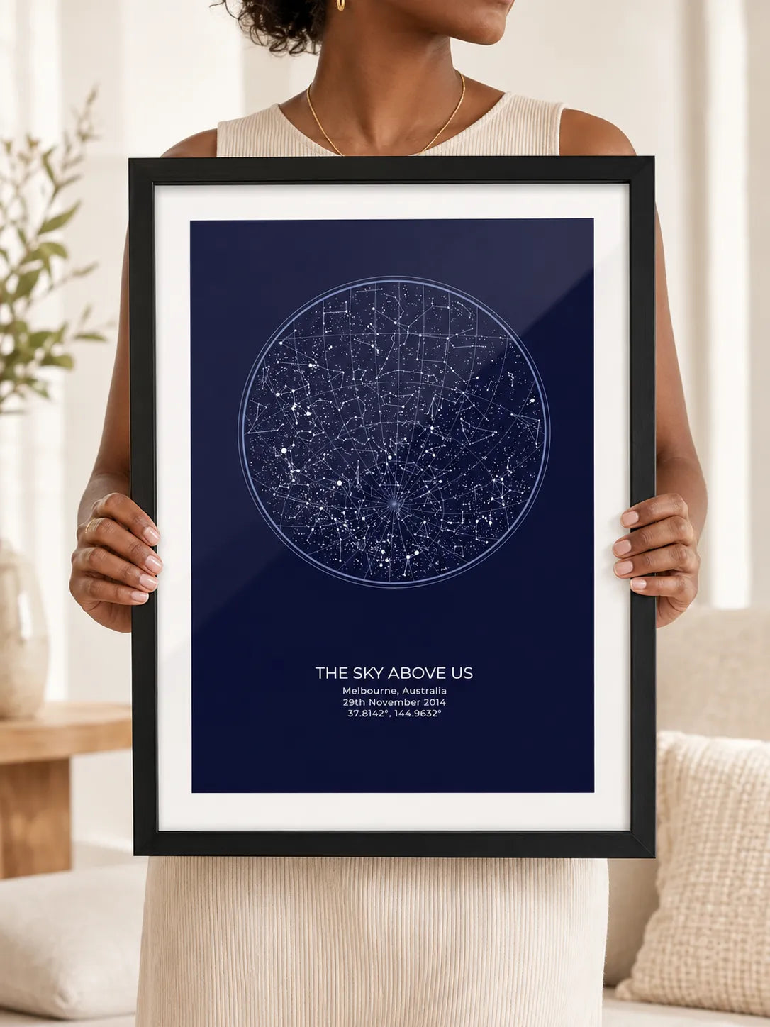 Framed star map print styled with plants