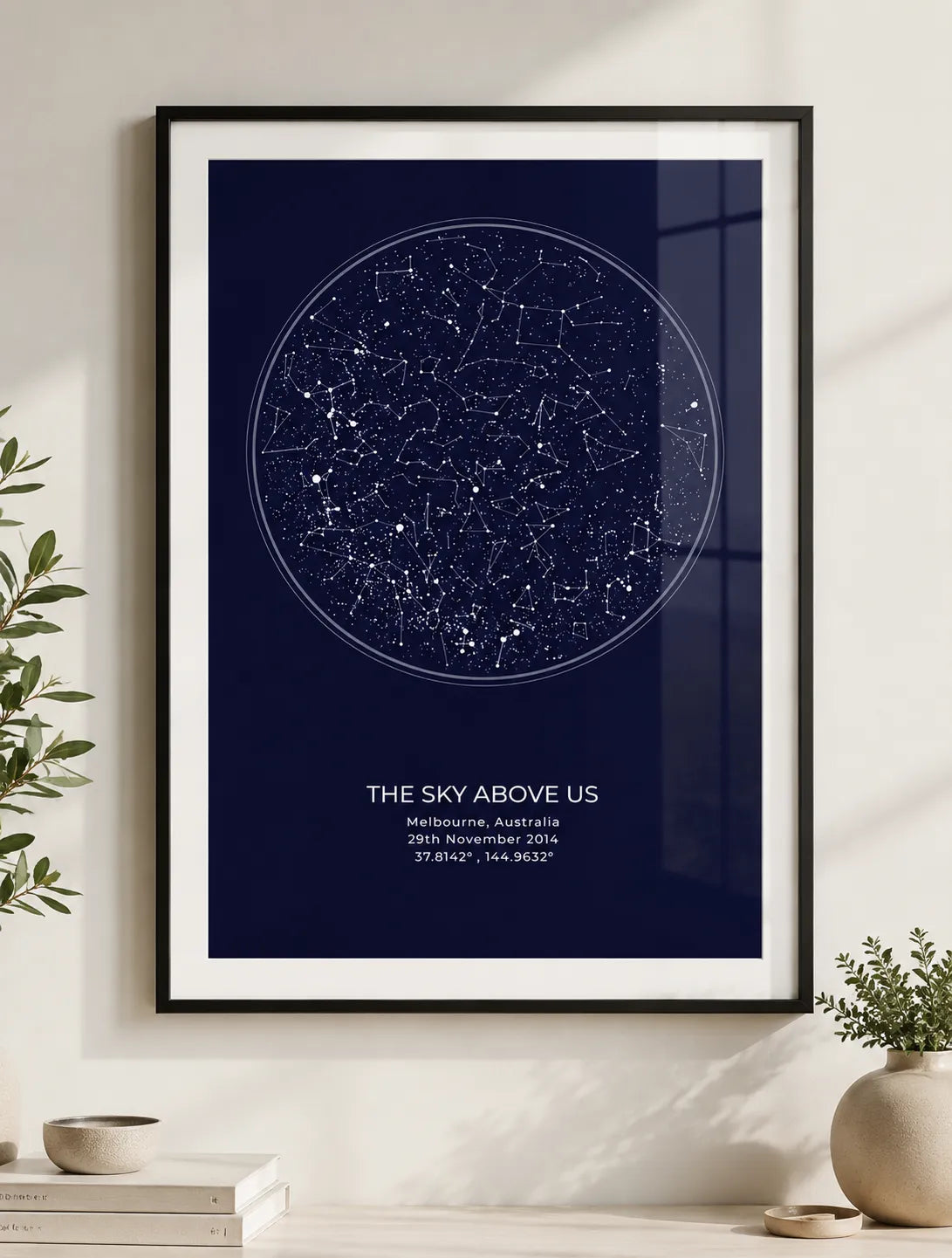 Couple with a framed star map print